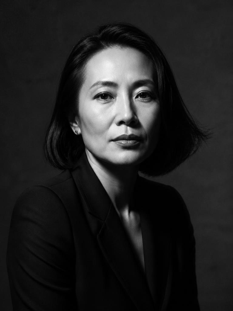 Editorial portrait of an executive in a dark blazer